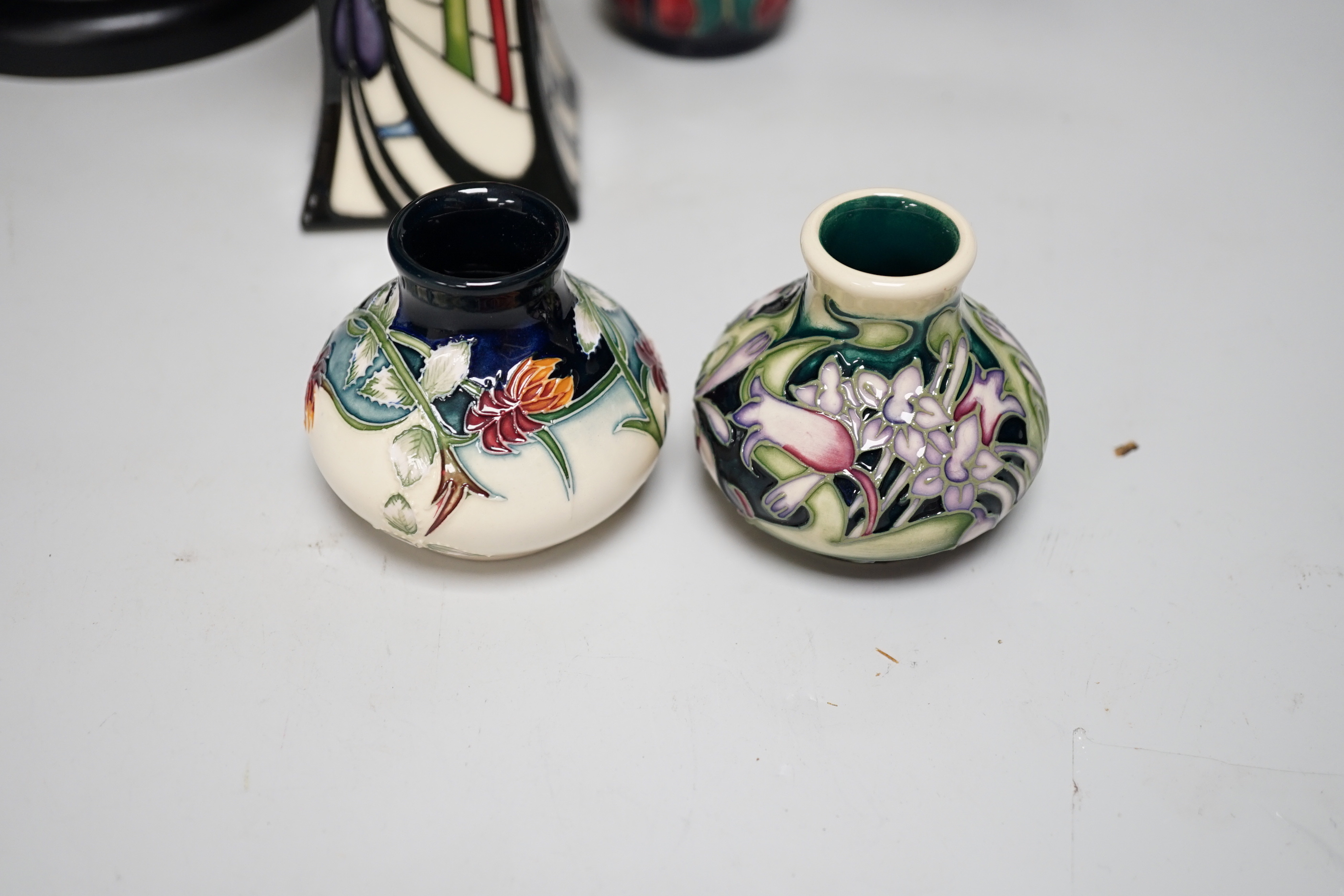 A group of Moorcroft vases, a lamp base and a pin dish, tallest 37cm